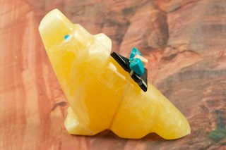 Zuni Wolf Fetish created by Zuni Artist Michael Mahooty. Signed by the artist. Carved from Genuine Golden Onyx with Turquoise Eyes. Genuine Jet, Turquoise and Spiny Oyster Shell Accents. 